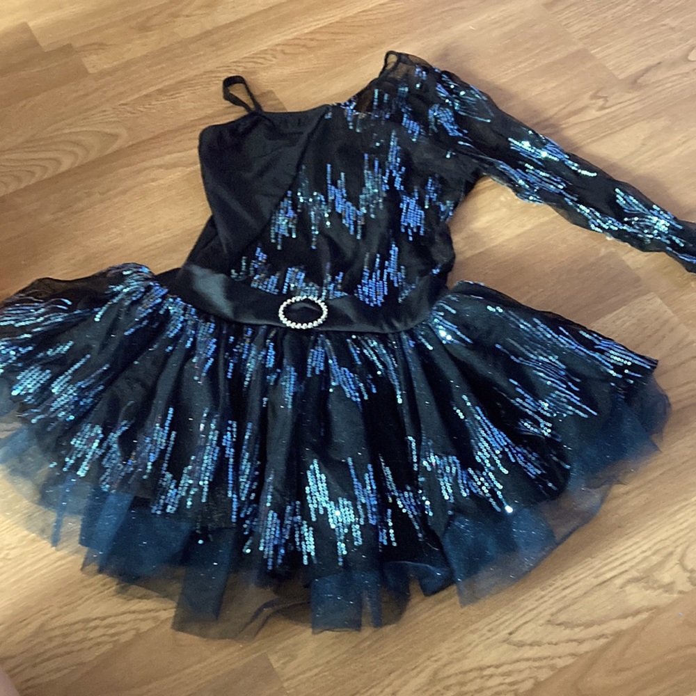 This is a revolution dance costume in size medium adult in colors black and blue